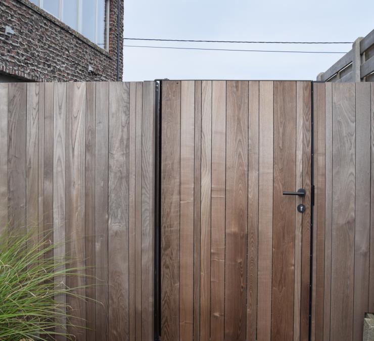 Wooden garden gate in fencing