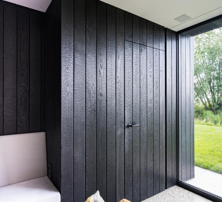 Wood panelling in charred thermo ash