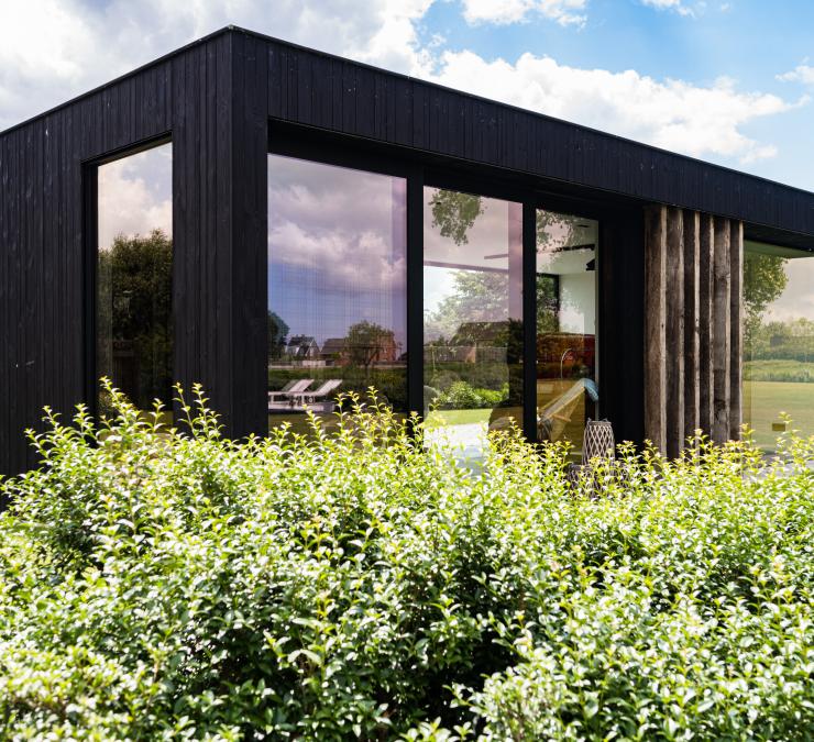 Wooden outbuilding in HOTwood pine Plus line with black finish