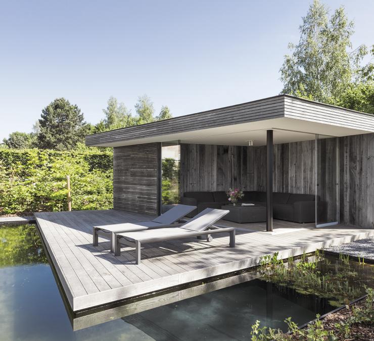 Modern pool house with floating deck in thermo ash