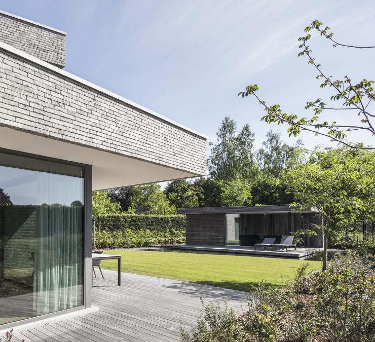 Modern pool house with floating deck in HOTwood ash