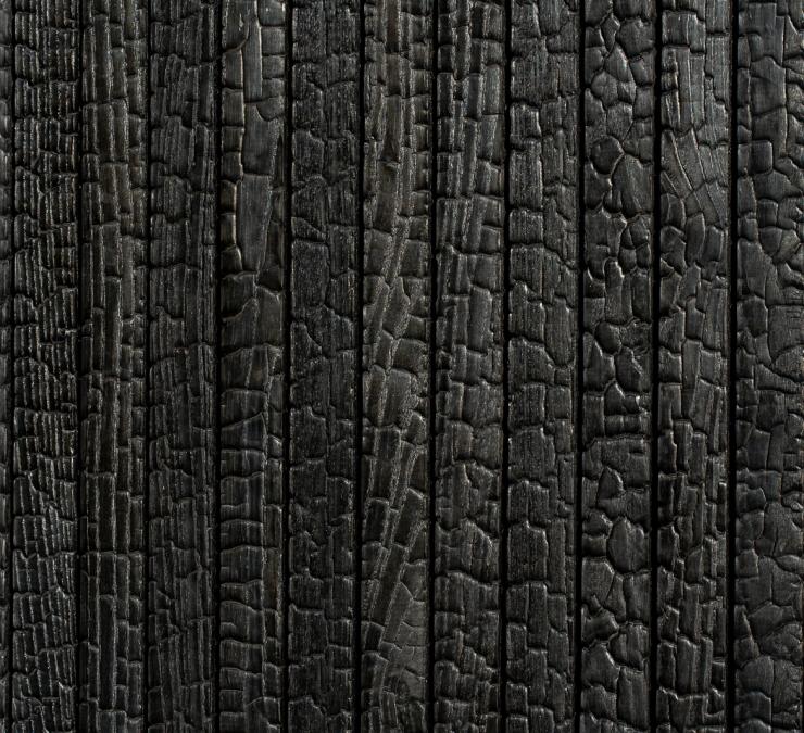 Timber cladding with intense black charred finish