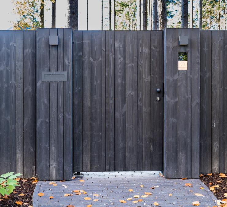 Wooden side gate incorporated into the fence for easier entry