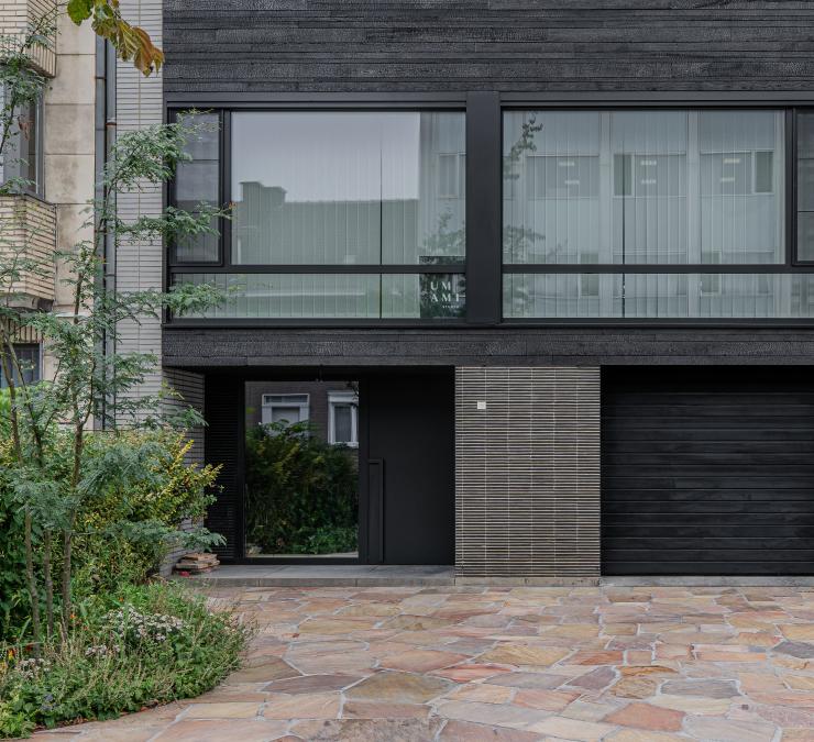 Terraced house with burnt black wood cladding