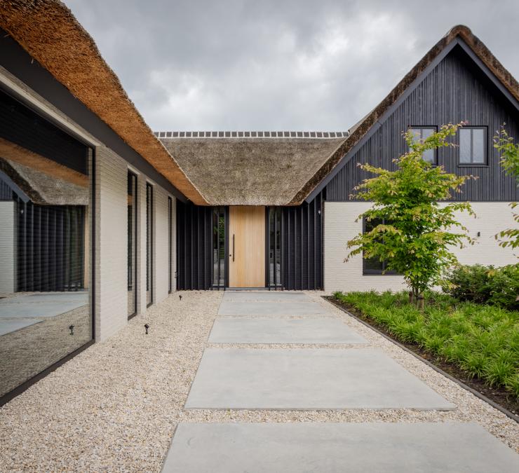 Stunning renovation with a black and white façade